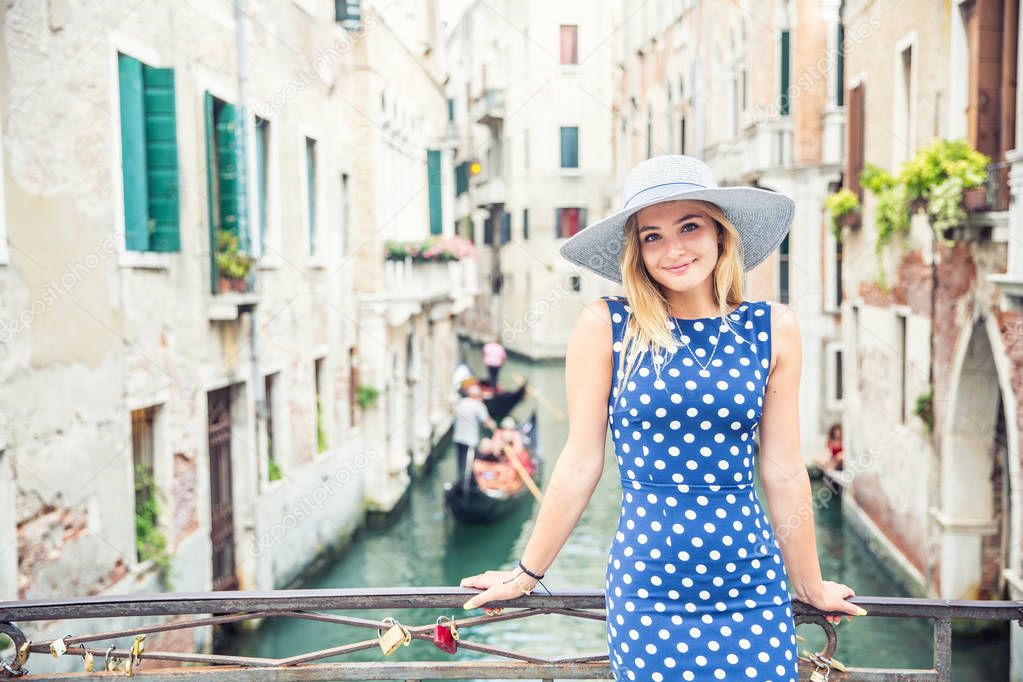 Happy young attractive woman fashion model of venice italy in bl