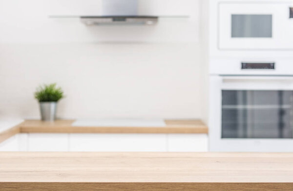 Empty kitchen desk an modern interior in the background