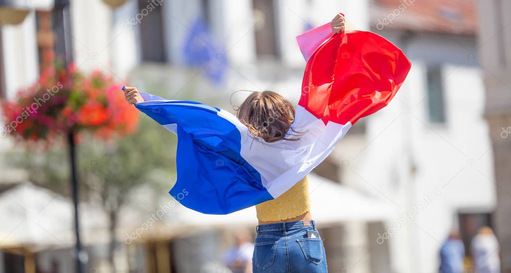 Attractive happy young girl with the Belgian flag
