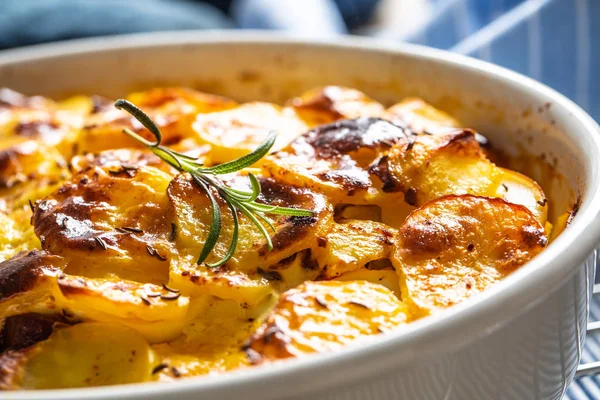 Roasted potatoes in baking dish traditional easten european food titled as france potato — Stock Photo, Image