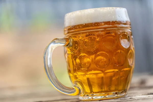 Pint of lager in a mug - close up — Stock Photo, Image