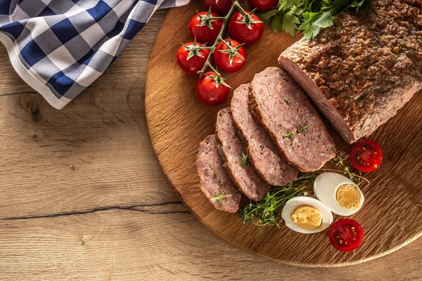 Homemade ground meatloaf with eggs tomatoes celery herbs and thyme — Stock Photo, Image