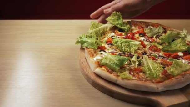 Hot pizza is put on the table in a cafe — Stock Video