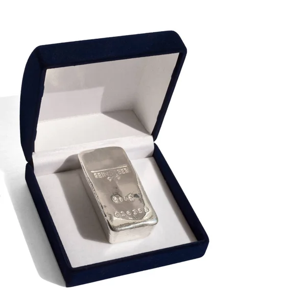Cast silver bullion in a velvet gift box. Isolated on a white background. feinsilber is fine silver.