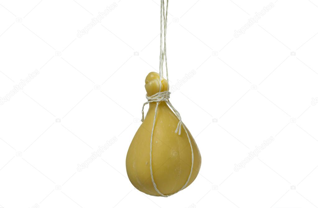 Typical Italian cheese Caciocavallo ripens in ropes in a hanging state. 