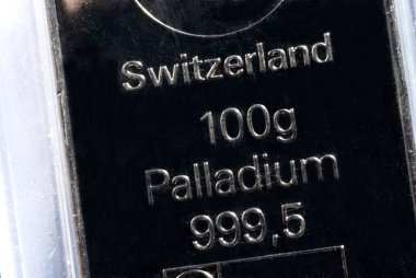 The surface of a palladium ingot. Palladium bar weighing 100 grams. clipart