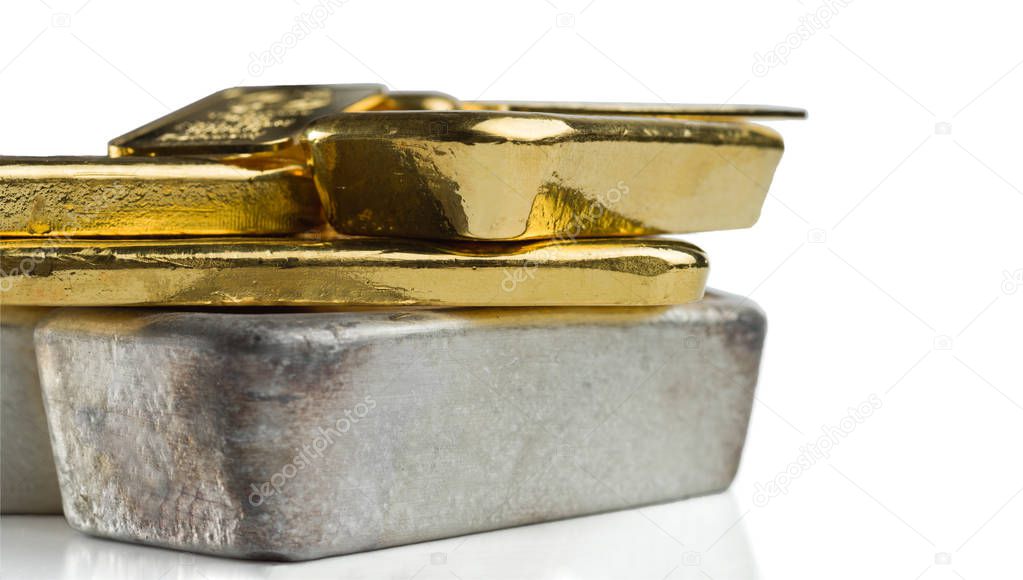 Several gold and silver bars of different weight isolated on a white background.