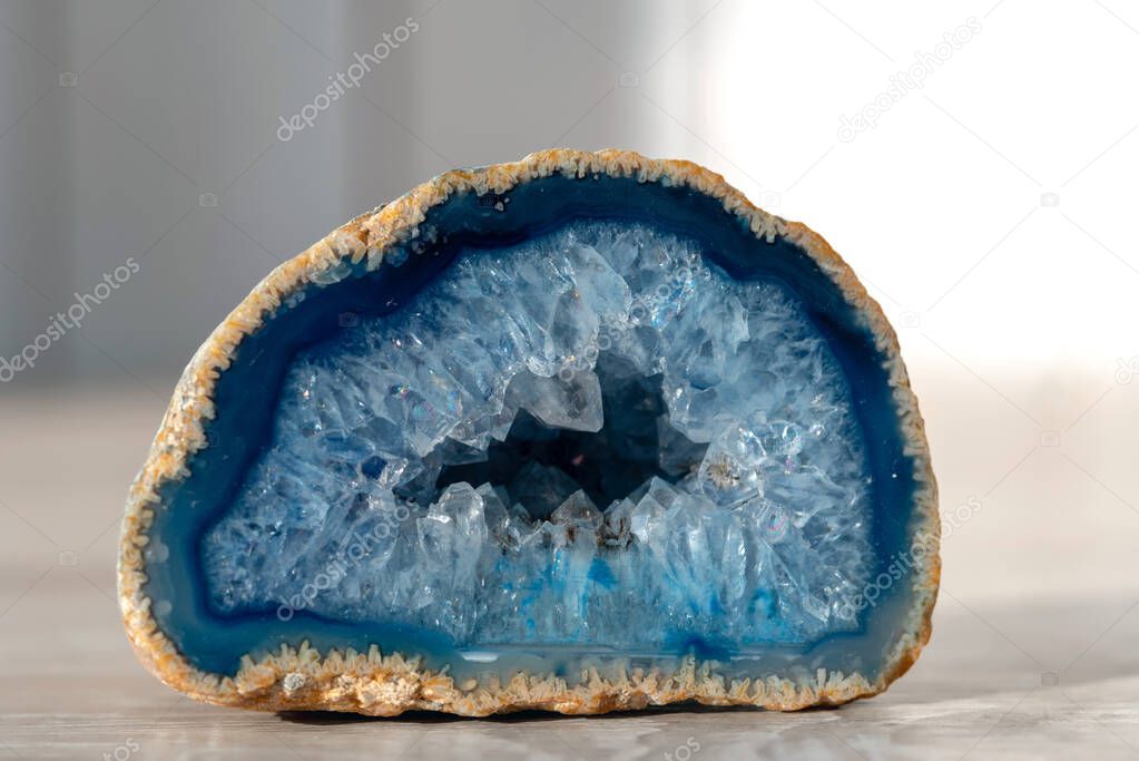 Geode with crystals of light-blue color. Quartz geode with transparent crystals.