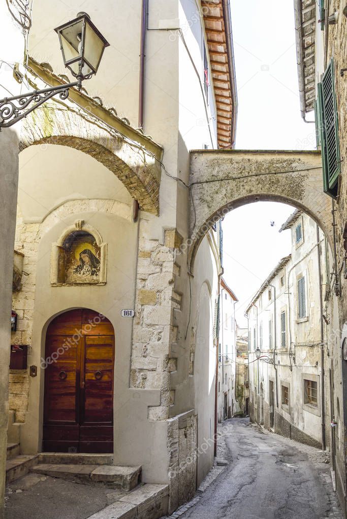 Amelia, Umbria. Pretty Italian village. Characteristic alley with a sacred image of the Virgin Mary