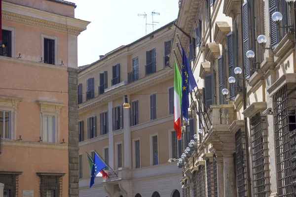 views of Rome with flags from Italy and the European community.