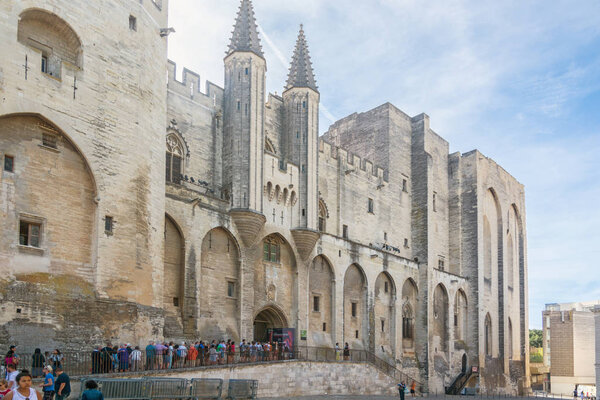 Avignon,France-august 12,2016:torist in line to visit the Palace of the Popes, famous christian landmark in France and Unesco heritage site during a sunny day