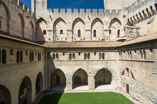 Avignon,France-august 12,2016:torist visit the Palace of the Popes, famous christian landmark in France and Unesco heritage site during a sunny day