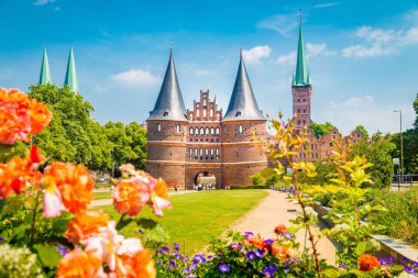 Historic town of Luebeck with famous Holstentor gate in summer, Schleswig-Holstein clipart