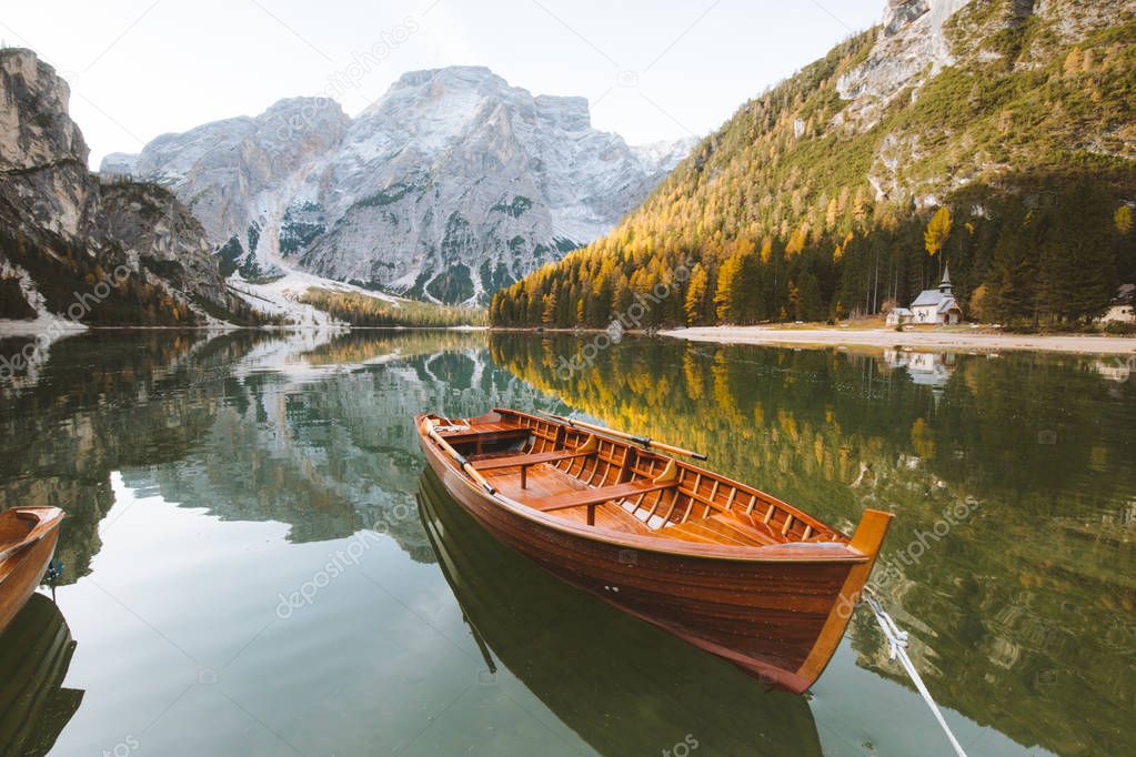 Traditional rowing boat on a lake in the Alps in fall