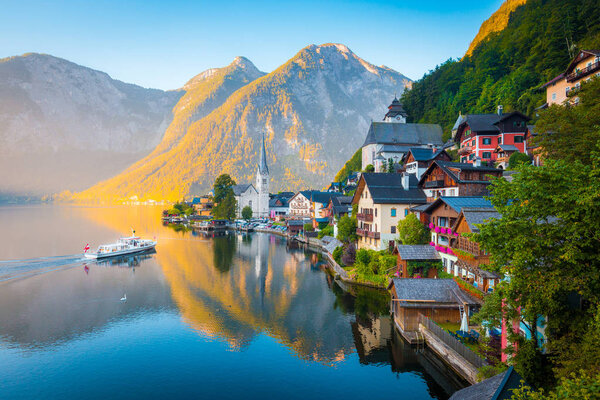 Hallstatt with ship at sunrise, Salzkammergut, Austria