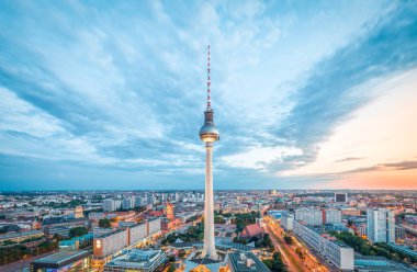 Aerial view of Berlin skyline with famous TV tower at Alexanderplatz and dramatic cloudscape in twilight during blue hour at dusk, Germany clipart