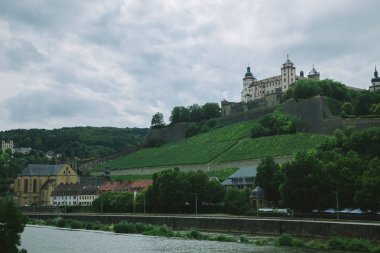 old historical Marienberg Fortress on hill near main river in Wurzburg, Germany clipart