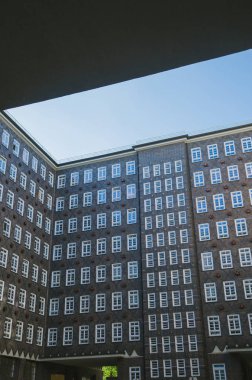low angle view of building under blue clear sky in Hamburg, Germany  clipart