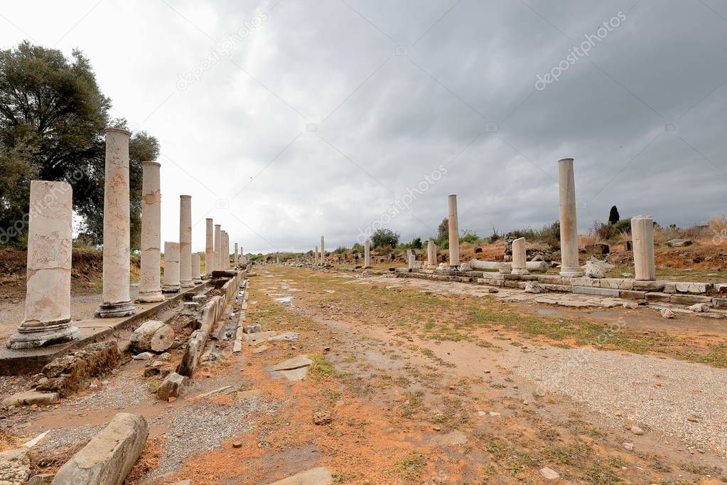 Ruins of the colonnaded street going S.from the main gate to the city center-both sides lined by remains of columns without capital on stylobates. City of Side-E.Pamphylian coast-Antalya prov.-Turkey.