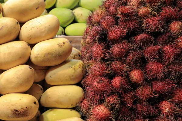 Rambutan Yellow Green Mango Fruits Piled Together Stall Ground Floor — Stock Photo, Image
