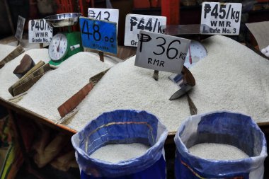 Stall selling several Filipino white rice varieties of different prices in its location at the ground floor of the Central Public Market. Bacolod city-Negros Occidental-Western Visayas-Philippines. clipart