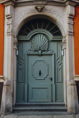 ancient wooden doors of european building, Wroclaw, Poland clipart