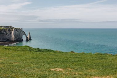 calm view of beautiful cliff and blue sea, Etretat, Normandy, France clipart
