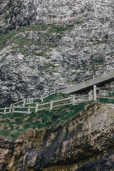 stairs with wooden railing on cliff, Etretat, Normandy, France