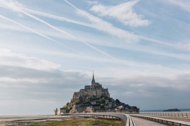 beautiful view of famous mont saint michel and walkway, normandy, france  