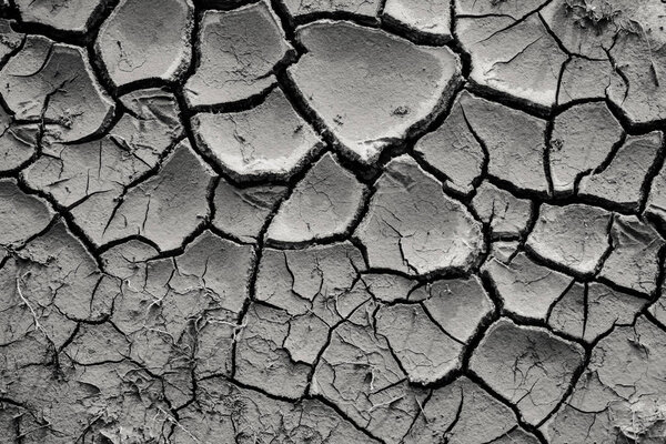 top view of cracked black dry ground, natural background