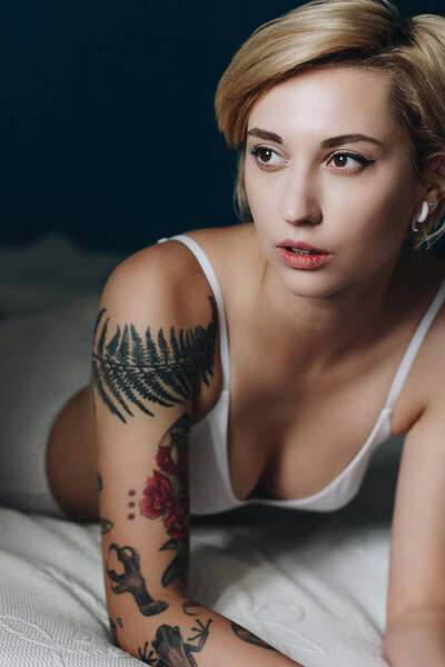 Sexy girl in underwear lying on bed and looking away — Stock Image Sexy Girl Underwear Lying Bed Looking Away Stock Image