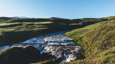 aerial view of beautiful Skoga river flowing through highlands in Iceland clipart