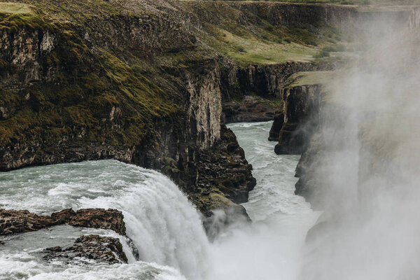 aerial view of beautiful Gullfoss waterfall flowing through highlands in Iceland