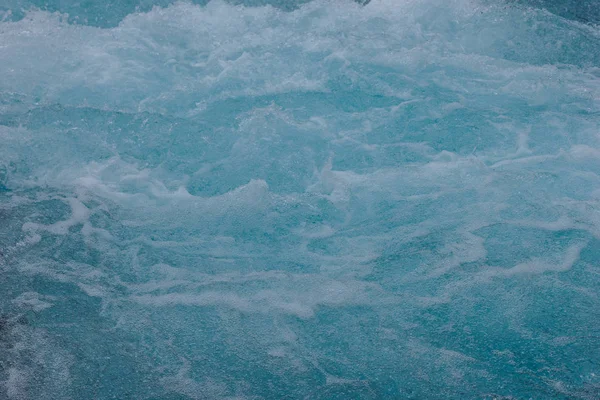 full frame image of blue water of Bruarfoss waterfall on Bruara river in Iceland 