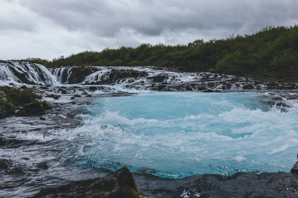 scenic view of beautiful Bruarfoss waterfall on Bruara river in Iceland