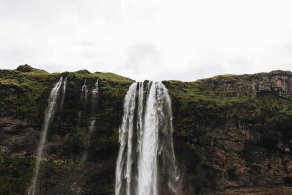 low angle view of Seljalandsfoss waterfall in highlands in Iceland 