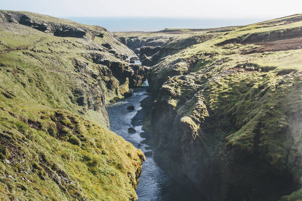 aerial view of beautiful Skoga river flowing through highlands in Iceland