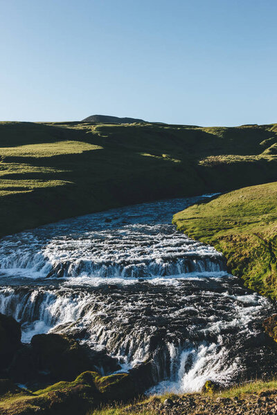 scenic view of beautiful mountain Skoga river flowing through highlands in Iceland