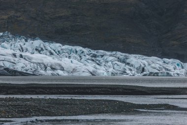 glacier Skaftafellsjkull and snowy coastline during daytime in Iceland clipart