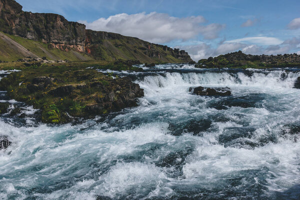 high angle view of beautiful mountain river flowing through highlands in Iceland