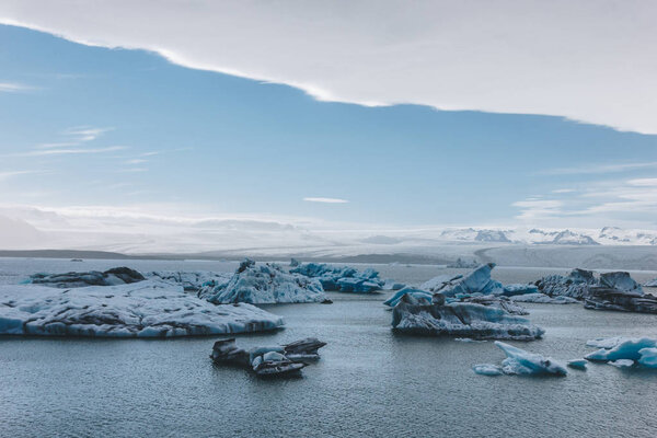 scenic shot of glacier ice pieces floating in lake in Jokulsarlon, Iceland