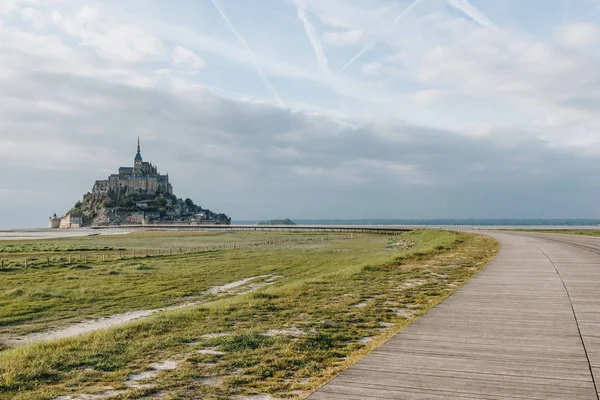 Beautiful view of famous mont saint michel and walkway at sea coast, normandy, france — Stock Photo