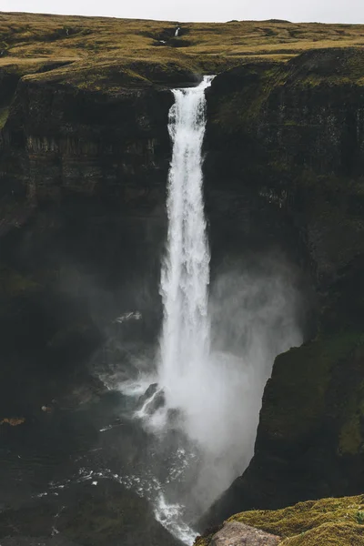 Dramatic Haifoss waterfall and rocky cliff, Iceland — Stock Photo