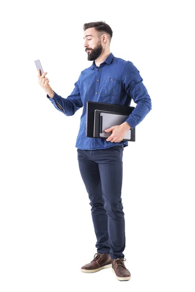 Young Adult Business Man Holding Laptop Tablet Arm Checking Cell — Stock Photo, Image