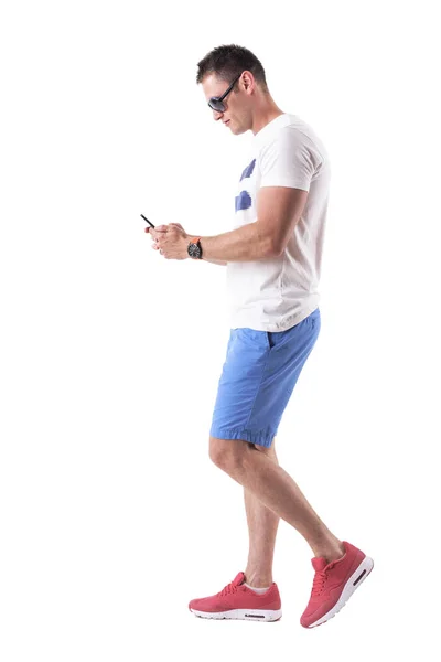 Side View Young Man Summer Clothes Walking Using Mobile Phone — Stock Photo, Image