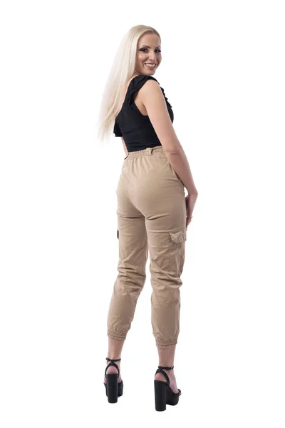 Vue Arrière Jeune Femme Blonde Joyeuse Tournant Souriant Caméra Pantalon — Photo