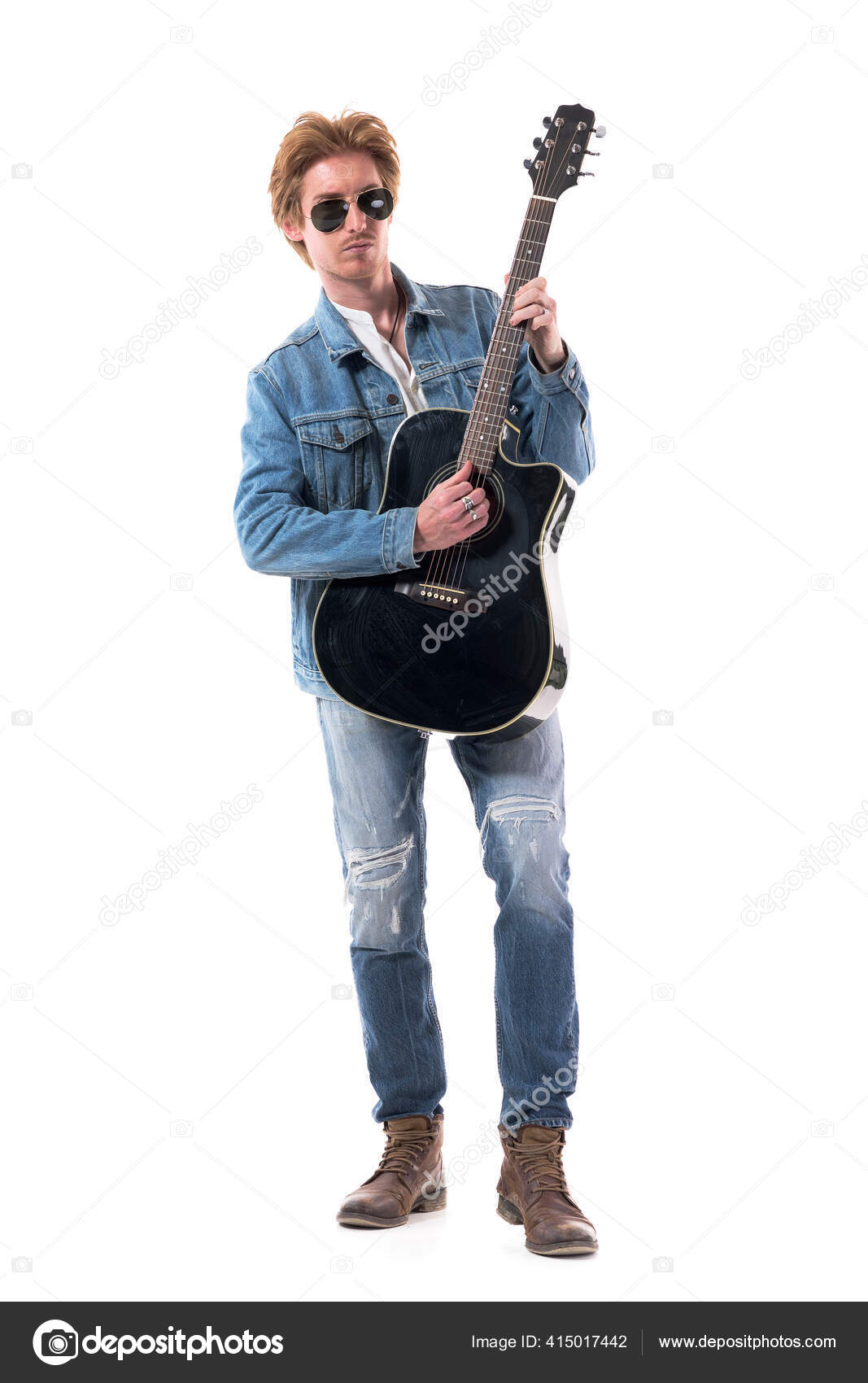 handsome rocker in sunglasses posing playing electric guitar isolated on  white, rock star guitar concept Stock Photo