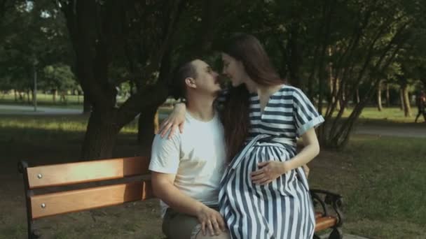 Joyful future parents expecting baby, relaxing in park — Stock Video