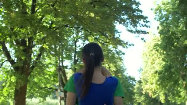 Happy couple in love embracing in public park — Stock Video