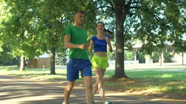 Couple runners celebrating after finishing workout — Stock Video